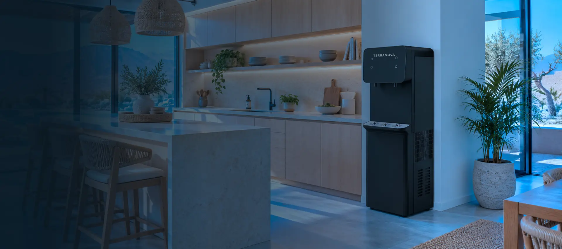 Dispensador AquaNova junto a una ventana con vista a la montaña, en una cocina moderna